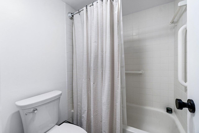 bathroom with shower / bath combo and toilet