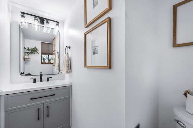 bathroom with vanity and toilet