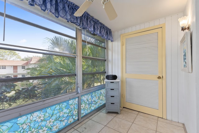 interior space with ceiling fan and light tile patterned floors