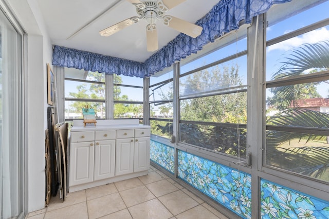 sunroom with a wealth of natural light and ceiling fan