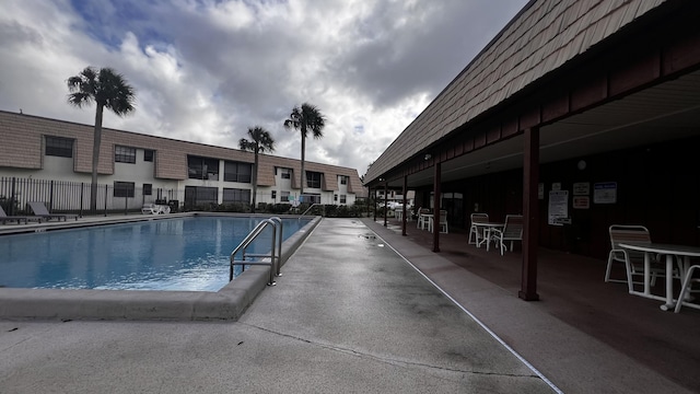 community pool featuring fence