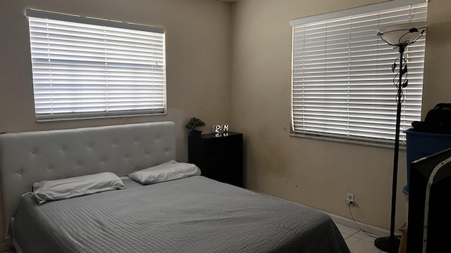 bedroom featuring tile patterned flooring