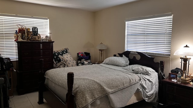 bedroom with light tile patterned floors