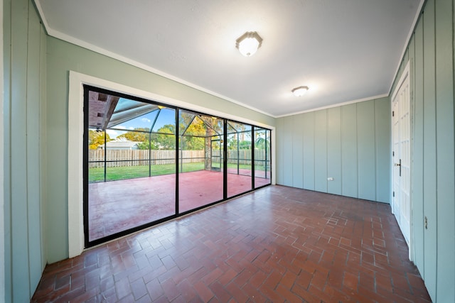 unfurnished room featuring crown molding