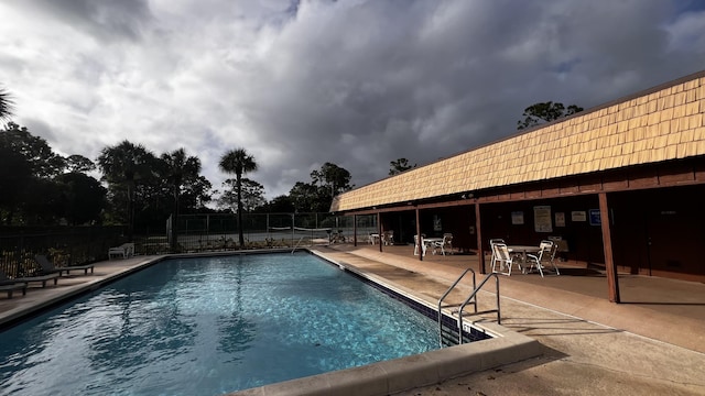 view of swimming pool with a patio area