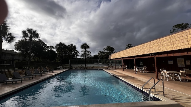 view of swimming pool featuring a patio