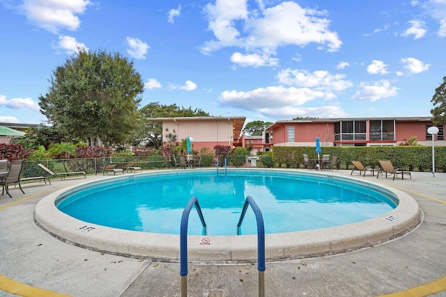 view of swimming pool with a patio