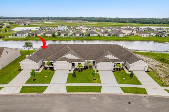 birds eye view of property featuring a water view