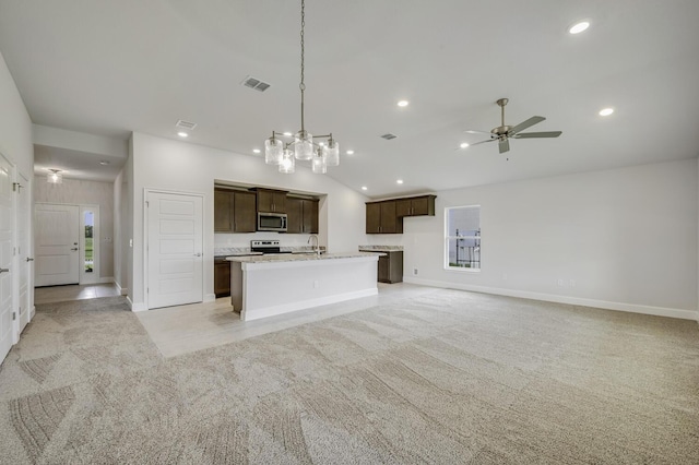 kitchen with light carpet, appliances with stainless steel finishes, dark brown cabinetry, and ceiling fan