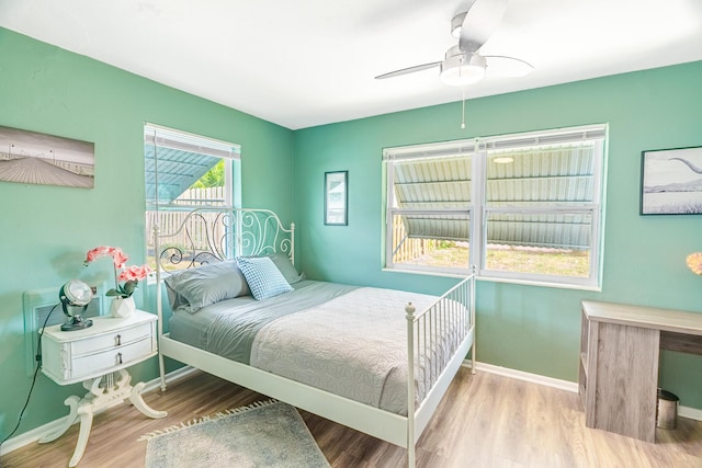 bedroom featuring light hardwood / wood-style floors and ceiling fan