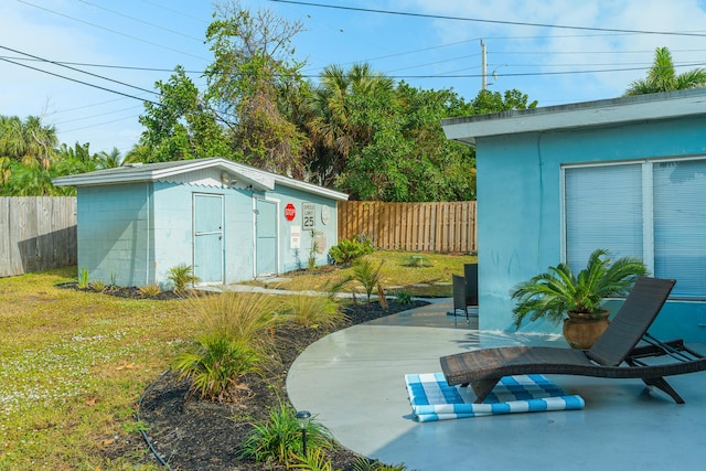 view of outbuilding featuring a lawn