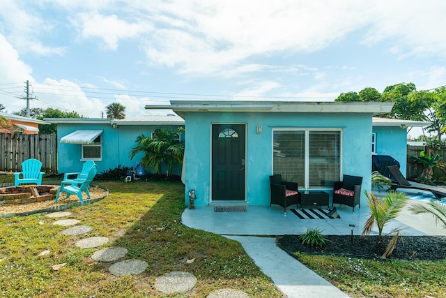 exterior space featuring a patio and a lawn