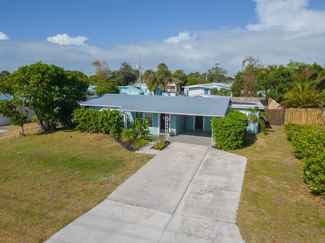 single story home featuring a front yard and a carport