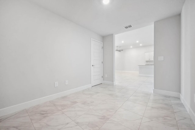 unfurnished room with ceiling fan