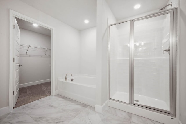 bathroom with separate shower and tub