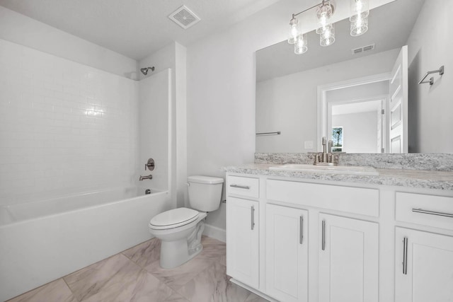 full bathroom featuring tiled shower / bath combo, toilet, and vanity