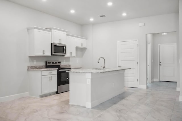 kitchen with a kitchen island with sink, sink, white cabinets, and stainless steel appliances