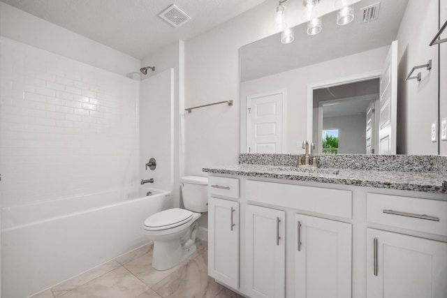 full bathroom with a textured ceiling, vanity, toilet, and tiled shower / bath