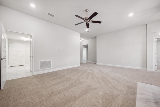 unfurnished room featuring light carpet and ceiling fan