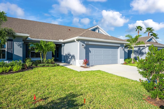 single story home featuring a garage and a front lawn