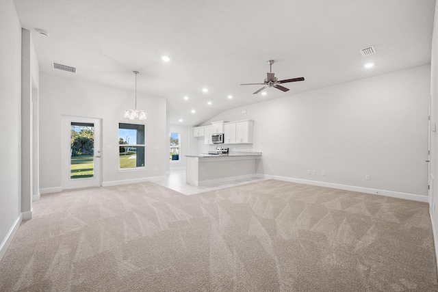 unfurnished living room featuring light carpet, ceiling fan, and lofted ceiling