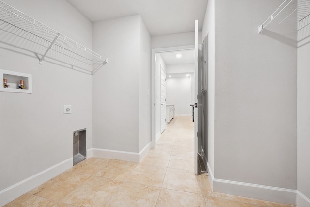 laundry room with electric dryer hookup, light tile patterned flooring, and hookup for a washing machine