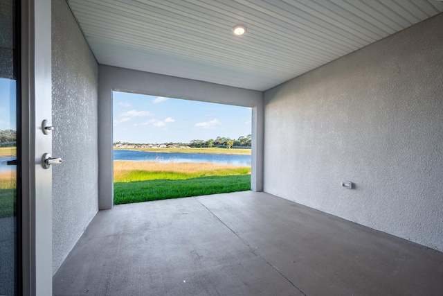 view of patio with a water view