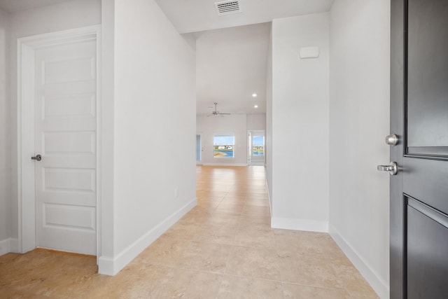 hallway featuring light tile patterned flooring