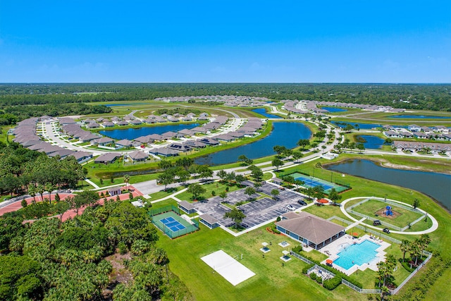 drone / aerial view with a water view and a residential view