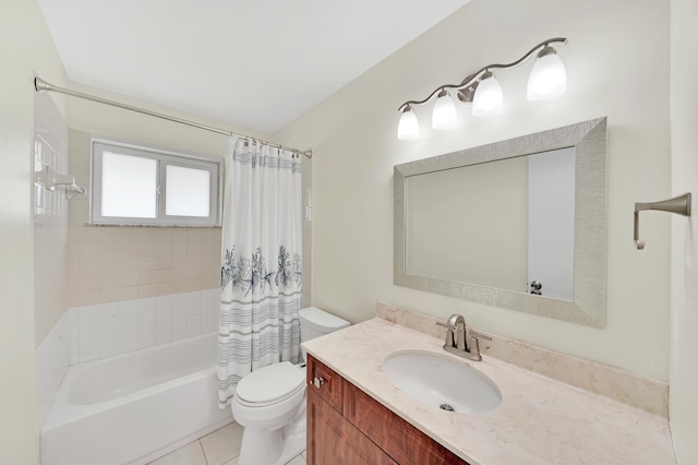 full bathroom featuring tile patterned flooring, vanity, toilet, and shower / bath combo with shower curtain