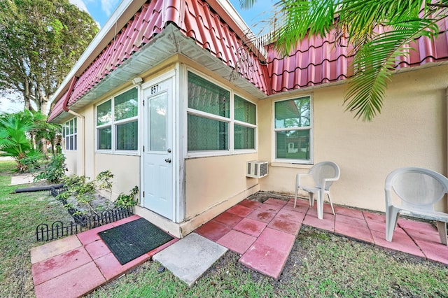 view of side of property featuring a wall mounted AC