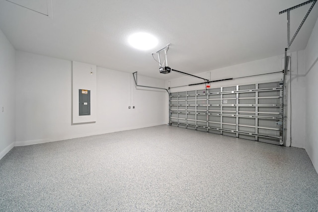 garage featuring electric panel and a garage door opener