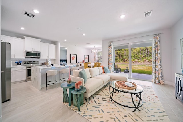 living room with light wood-type flooring