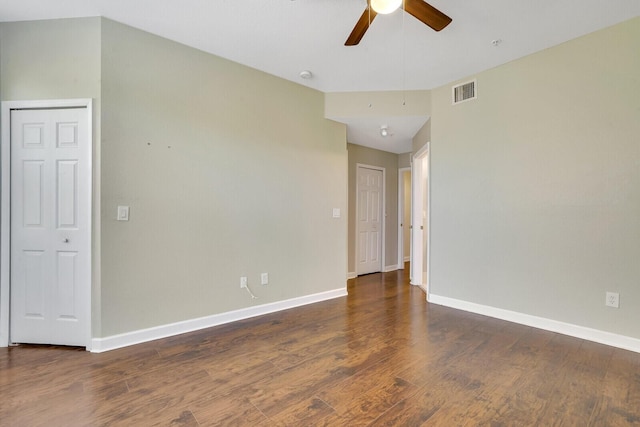 unfurnished room featuring dark hardwood / wood-style floors and ceiling fan