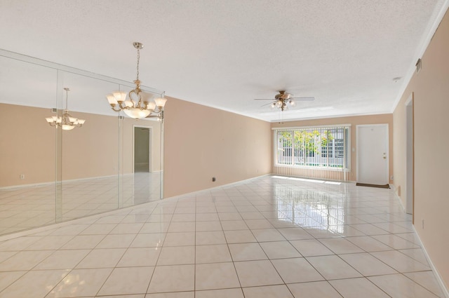 tiled empty room with a textured ceiling and ceiling fan with notable chandelier