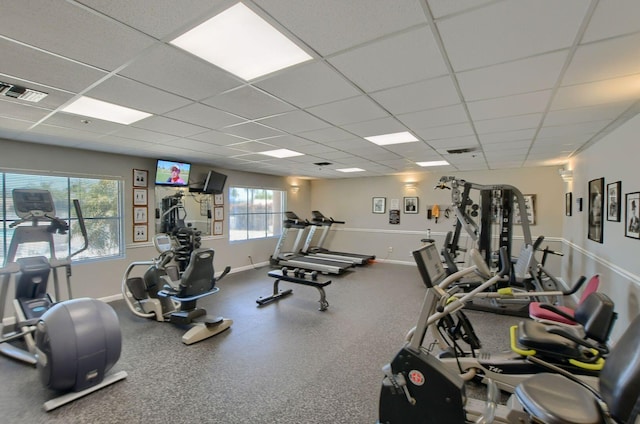 workout area featuring a drop ceiling