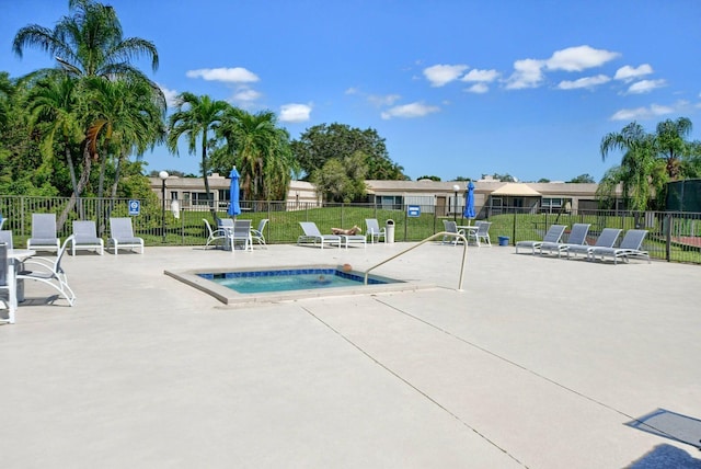 view of swimming pool with a lawn and a patio