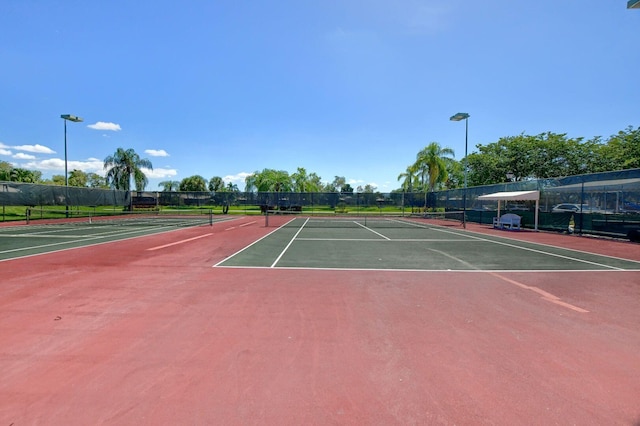 view of tennis court featuring basketball court