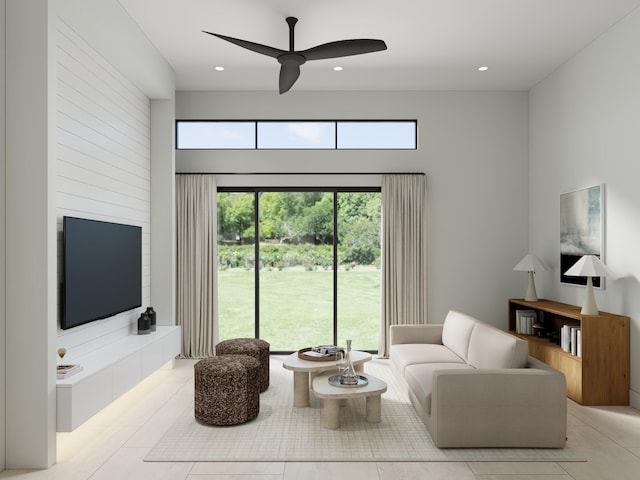 living room featuring ceiling fan and light tile patterned floors