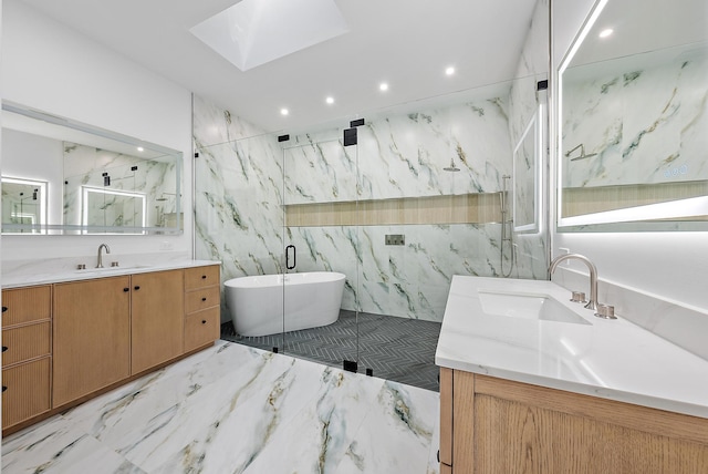 bathroom featuring shower with separate bathtub, vanity, a skylight, and tile walls