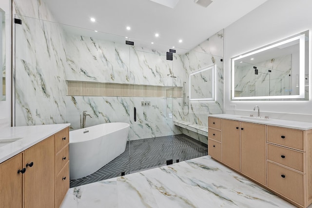 bathroom with vanity and separate shower and tub