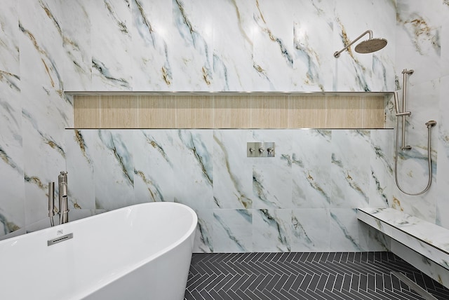 bathroom featuring separate shower and tub and tile walls