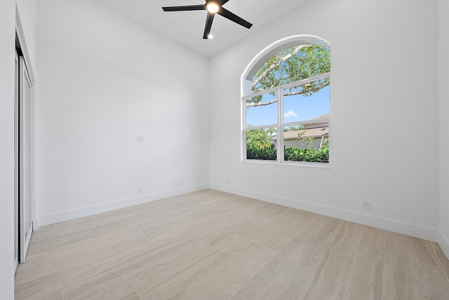 unfurnished room featuring light hardwood / wood-style floors and ceiling fan