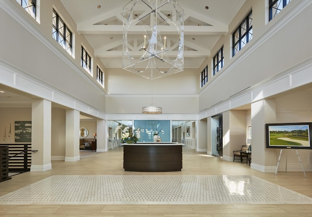 welcome area featuring a notable chandelier