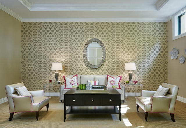 living area featuring light colored carpet, a raised ceiling, and ornamental molding