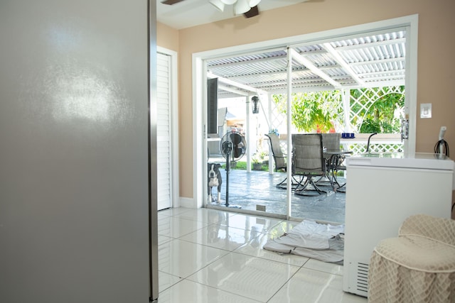 interior space with ceiling fan