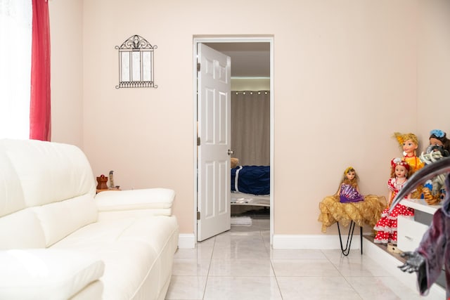 sitting room with light tile patterned floors