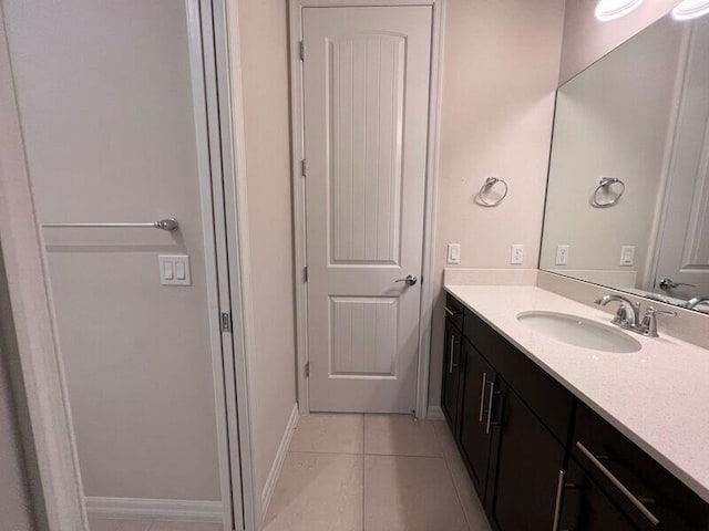 bathroom featuring tile patterned flooring and vanity