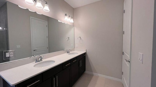 bathroom with tile patterned floors and vanity