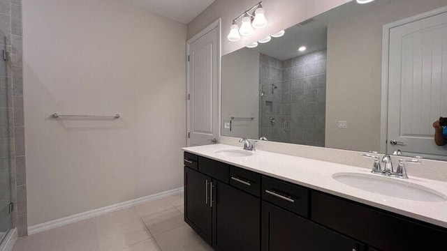 bathroom featuring vanity, tile patterned floors, and walk in shower